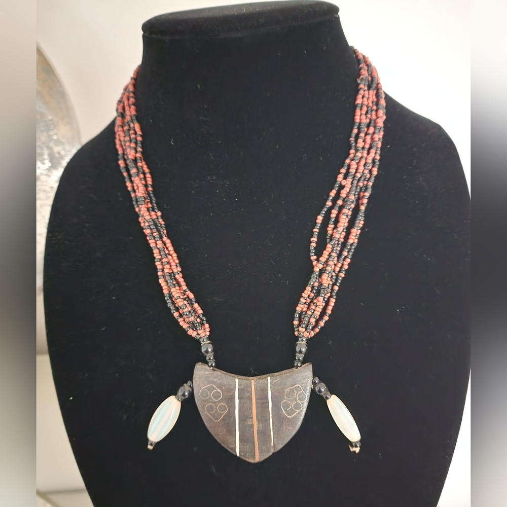 Tribal Ghanian beaded necklace with ebony wood pendant.